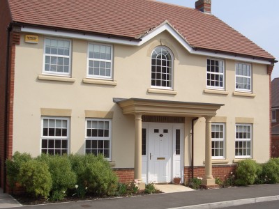 large house showing windows and front door